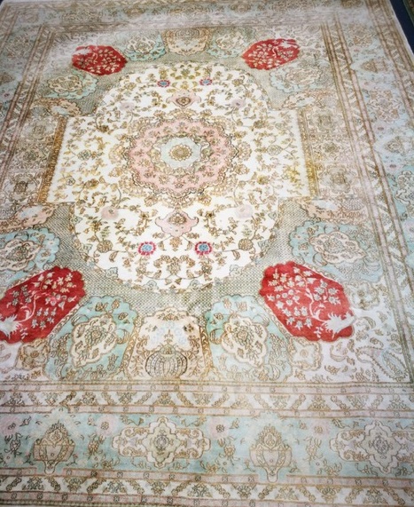 A North West Persian ivory ground carpet 300 x 245cm